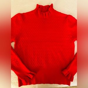 Gorgeous red sweater with ruffle neck and sleeves detail. New without tags.